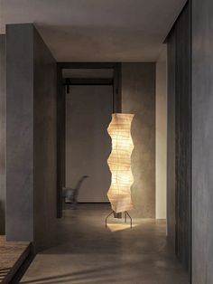 a lamp that is sitting in the middle of a room