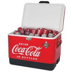 a red cooler filled with lots of coca - colas on top of a white background