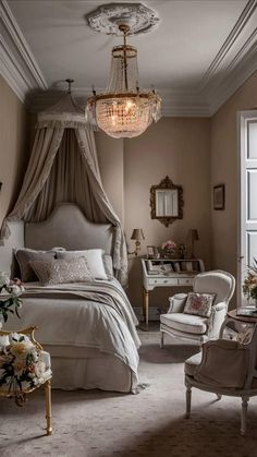 a bed room with a neatly made bed and a chandelier hanging from the ceiling