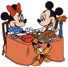 two mickey mouses sitting at a table with a plate of food in front of them