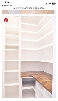 an empty white closet with shelves and wooden counter top on the bottom right hand corner