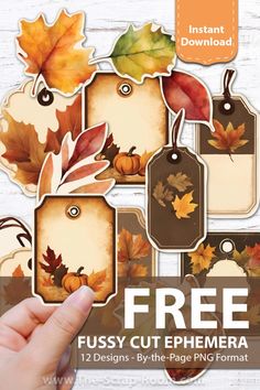 a hand holding up a paper cutout with autumn leaves on it and the words, free