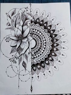 a black and white drawing of a flower