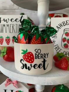 some strawberries are in a bowl on a shelf