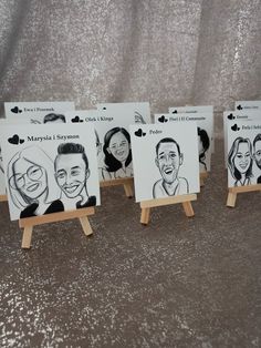 four wooden eases with pictures of people on them