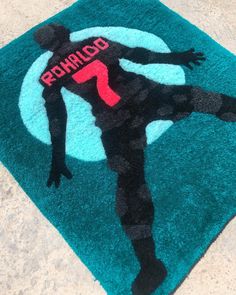 a rug with a soccer player painted on it