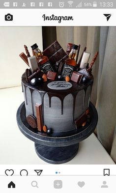 there is a chocolate cake with liquor on the top and candies in the middle