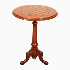 a small wooden table with a chess board on it's top and two legs