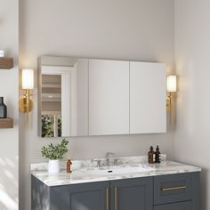 a bathroom vanity with two sinks and mirrors on the wall next to it is illuminated by lights