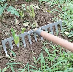 a garden tool is stuck in the ground