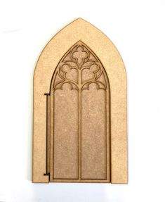 an image of a church window on the side of a building that looks like it is made out of wood