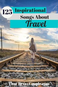 a woman walking down train tracks with the words 25 inspirational songs about travel on it