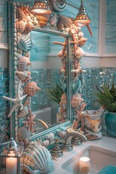 a bathroom sink topped with a mirror covered in seashells