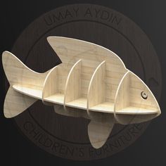 a wooden fish shaped shelf with five sections