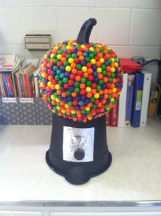 a fake pumpkin made out of candy balls