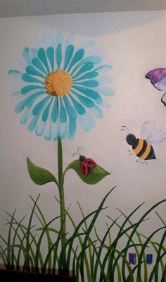 a painting of flowers and bugs painted on the wall