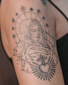 a woman's arm with a tattoo on it and an apple in the center