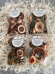 four slices of fruit are on display in a box with white shredded paper around them