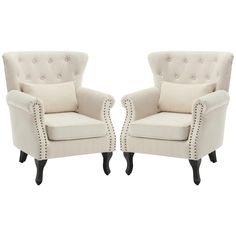 a pair of white chairs sitting next to each other