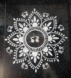 a black and white design on the ground