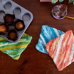 a muffin tin and some cupcakes on a table