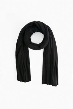 Known primarily for its cashmere products, White + Warren is a fan-favorite brand that produces incredibly soft closet staples. The travel wrap is an iconic piece and is in high demand year after year. This season-less accessory is perfect to wrap up with on cold days, ideal for travel, and can be worn in endless ways: as a shawl, scarf, snood, shrug or blanket. Once you have one you wonâ€™t be able to live without it! 
100% Cashmere in 7 gauge knit; 2-ply
Care: Hand wash cold or dry clean. Do not twist or wring. Reshape and lay flat to dry. Warm iron if needed Black Cashmere Scarf, Cashmere Travel Wrap, Travel Wrap, Best Wraps, Cashmere Accessories, Cashmere Wrap, Oversized Scarf, Closet Staples, Shawl Scarf