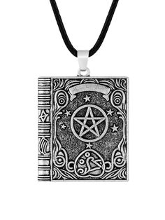 a pendant with an inverted pentagramil on it, hanging from a black cord