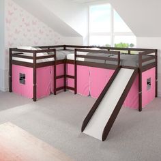 a room with bunk beds and a slide in the middle, on top of carpeted flooring