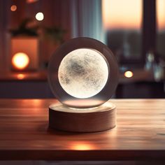 an illuminated object on top of a wooden table in front of a window at night