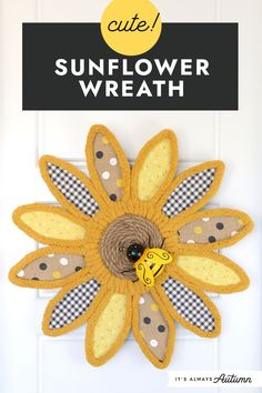 a sunflower wreath hanging on the front door with text overlay that reads cute sunflower wreath