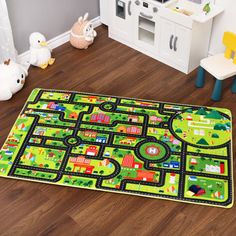 a child's play area with toys on the floor and rugs in front of it