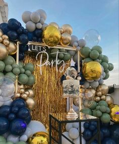 balloons and streamers decorate the entrance to a party