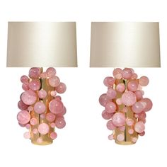 two lamps with pink glass balls on them