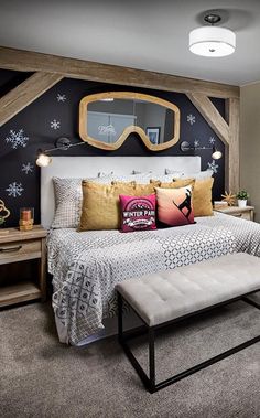 a bedroom with a large bed, mirror and dresser in it's center area