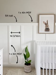 a baby's room with white walls and pictures on the wall, including a crib