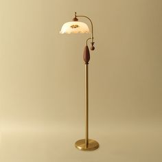 The classic retro design, with its elegant curved arms and wavy edge lampshade complementing each other, exudes a nostalgic warmth. The combination of gold and wood elements not only provides warm lighting, but also adds a unique decorative effect.