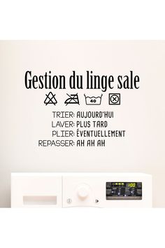 a wall decal with the words gestion du linge sale on it