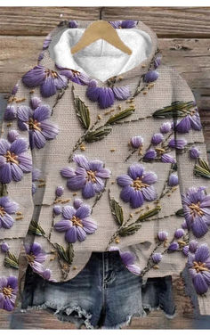 a white jacket with purple flowers on it