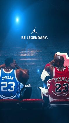 two basketball players sitting on the bench in front of a sign that says be legendary