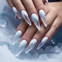 Chill out with this bold winter design! Frosty icicle drips made from translucent gel hang from your nails, while frosty, frozen tips give a frostbite effect for a daring Christmas look. Perfect for icy, chic holiday vibes. Christmas Nails Frozen, Ice Blue Snowflake Nails, Icicle Nail Designs, Icecicle Nails, Frosty Christmas Nails, White And Blue Winter Nails, Winter Acrylic Nails Ideas, Clear Winter Nails, Light Blue Nails Winter