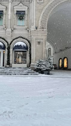 a large building with snow on the ground