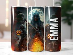 three halloween themed cans on a table