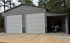 two garages with one car parked in the driveway and another on the other side