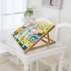 a white table with a wooden tray on top of it