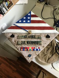 a decorated graduation cap sitting on top of a desk