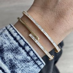 Baguette Diamond Bangle MATERIALSAvailable in 14k Yellow Gold, 14k Rose Gold and 14k White Gold DETAILSGold Weight: 8.40gCT Weight: 1.16 ct DimensionsWidth: 3mm *If in stock will ship in 2-3 business days. If back-ordered, please allow 4-7 weeks for delivery. Rush options may be available please contact hello@alevjewelry.com Luxury White Gold Bangle With Baguette Diamonds, Diamond Bangle Bracelet, Necklace Length Guide, Stacked Wedding Rings, Bracelet Size Chart, Diamond Baguette, Diamond Bangles Bracelet, White Gold Bracelet, Baguette Diamonds