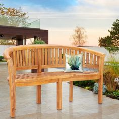 a wooden bench sitting on top of a patio