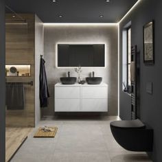 a modern bathroom with two sinks and a television mounted on the wall above it's mirror