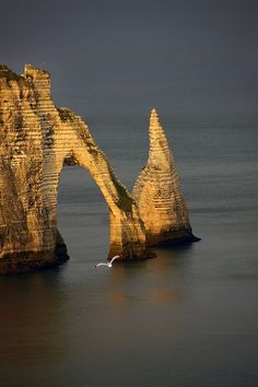 two large rocks sticking out of the water