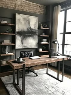 an office with a large painting on the wall and a leather chair in front of it